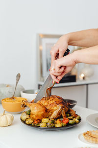 Midsection of person preparing food on table