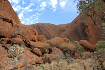 View of rock formations against cloudy sky
