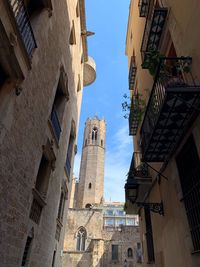 Low angle view of buildings in city against sky