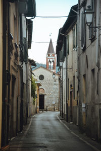 Alley amidst buildings in city