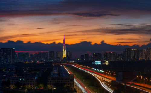 High angle view of illuminated central buildings against sky during sunset in ho chi minh city