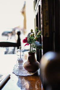 Close-up of flower vase on table