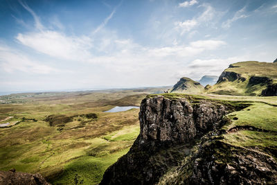 Scenic view of landscape and mountains against sky