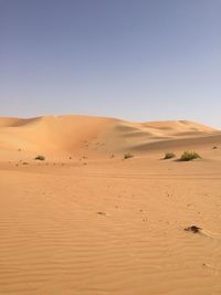 Scenic view of desert against clear sky