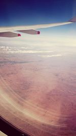 Cropped image of airplane on landscape
