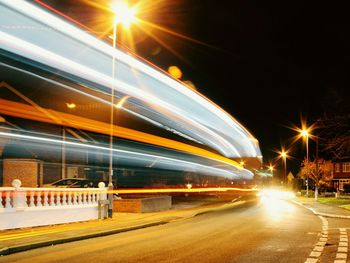 Traffic light trails on road at night