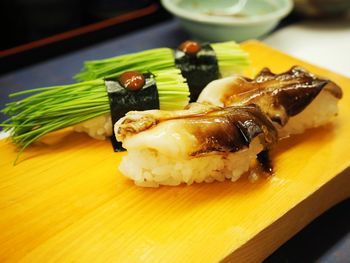 Close-up of sushi on serving board