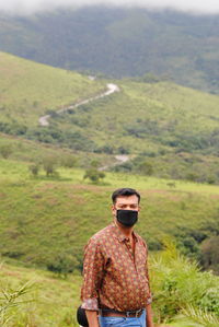 Young man standing on field