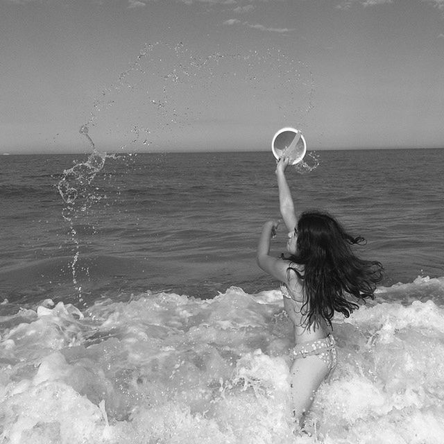 sea, horizon over water, water, wave, leisure activity, surf, splashing, beach, lifestyles, motion, shore, vacations, scenics, full length, rear view, beauty in nature, nature, sky