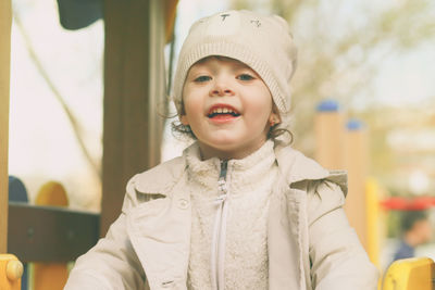 Portrait of cute girl standing at playground