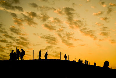 Silhouette people at sunset