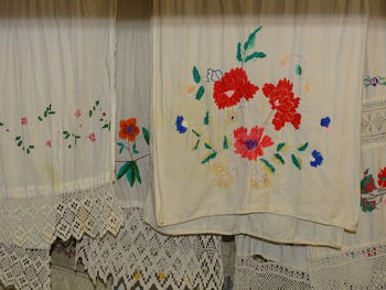 Close-up of white curtain hanging at home