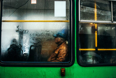 Man seen through train window