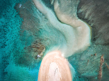 High angle view of rock formation in sea