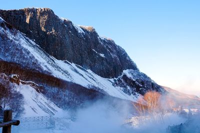 Mountain against clear sky during winter