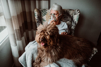 Woman with dog at home