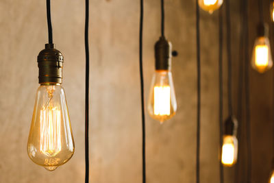 Close-up of illuminated light bulb