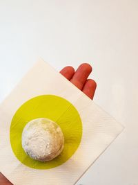 High angle view of mochi ice-cream on a hand-held napkin