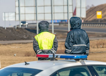 Traffic police officers monitor the movement of cars