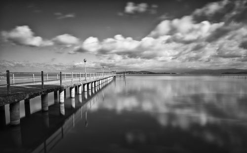 Pier on sea against sky