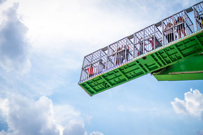 Low angle view of road sign against sky