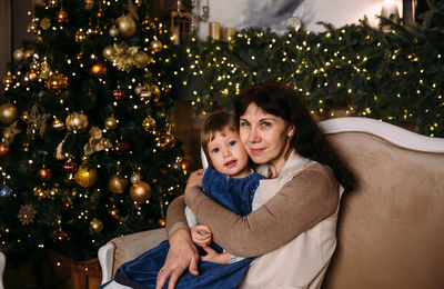 Grandmother and little granddaughter spend time together at christmas time.