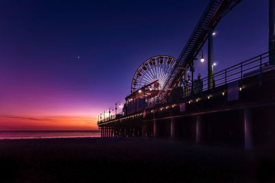 Ferris wheel at beach during night