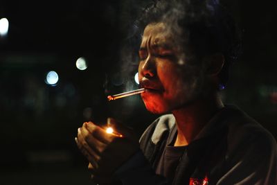 Close-up of man smoking cigarette