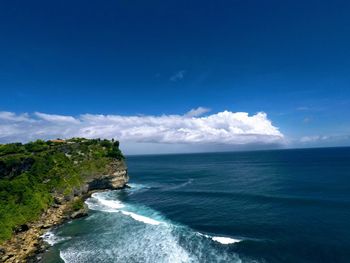 Scenic view of sea against blue sky