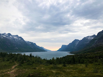 Scenic view of landscape and mountains against sky