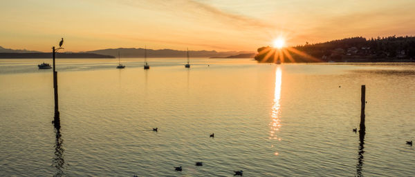 Scenic view of lake against sky during sunset