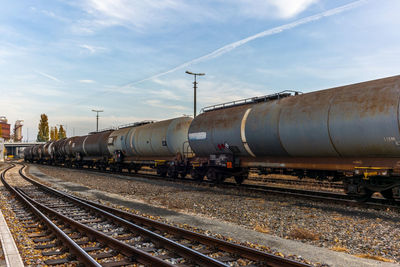 Train on railroad tracks against sky