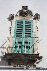 Low angle view of sculpture on building wall