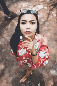 Portrait of young woman standing outdoors