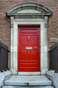 Old-fashioned red door in london, uk