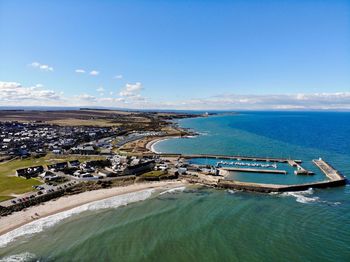 High angle view of sea against blue sky