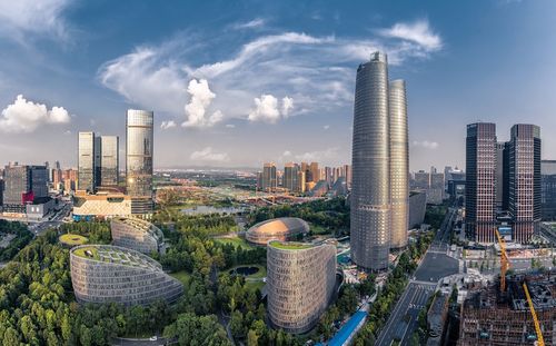 Panoramic view of buildings in city against sky