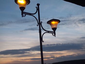 Low angle view of street light against sky