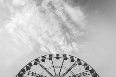 Low angle view of ferris wheel against sky