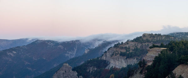 Scenic view of mountains against sky during sunset