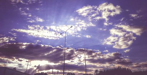 Low angle view of street light against sky