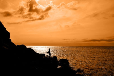 Scenic view of sea at sunset