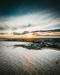 Scenic view of beach against sky during sunset
