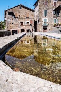 Reflection of old building in canal