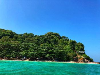 Scenic view of sea against clear blue sky