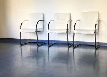 Empty chairs at waiting area