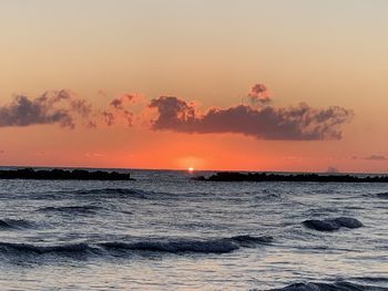 Scenic view of sea against sky during sunset