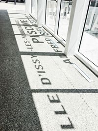 Text on footpath by building in city