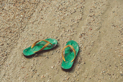 High angle view of shoes on sand