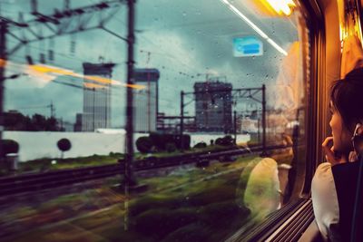 Reflection of train on glass window